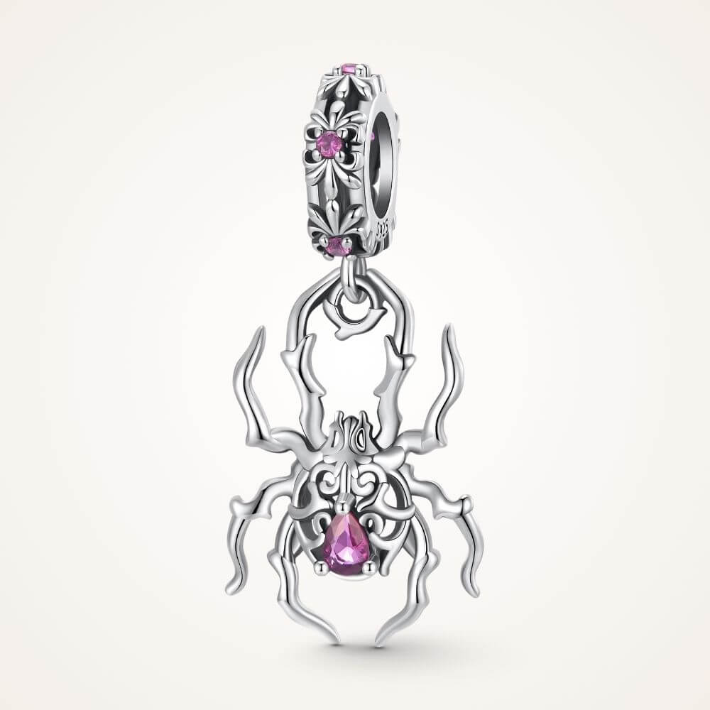 Sterling silver spider charm with gothic web details, pink crystals, and an ornate dangling body design - ORÉYA