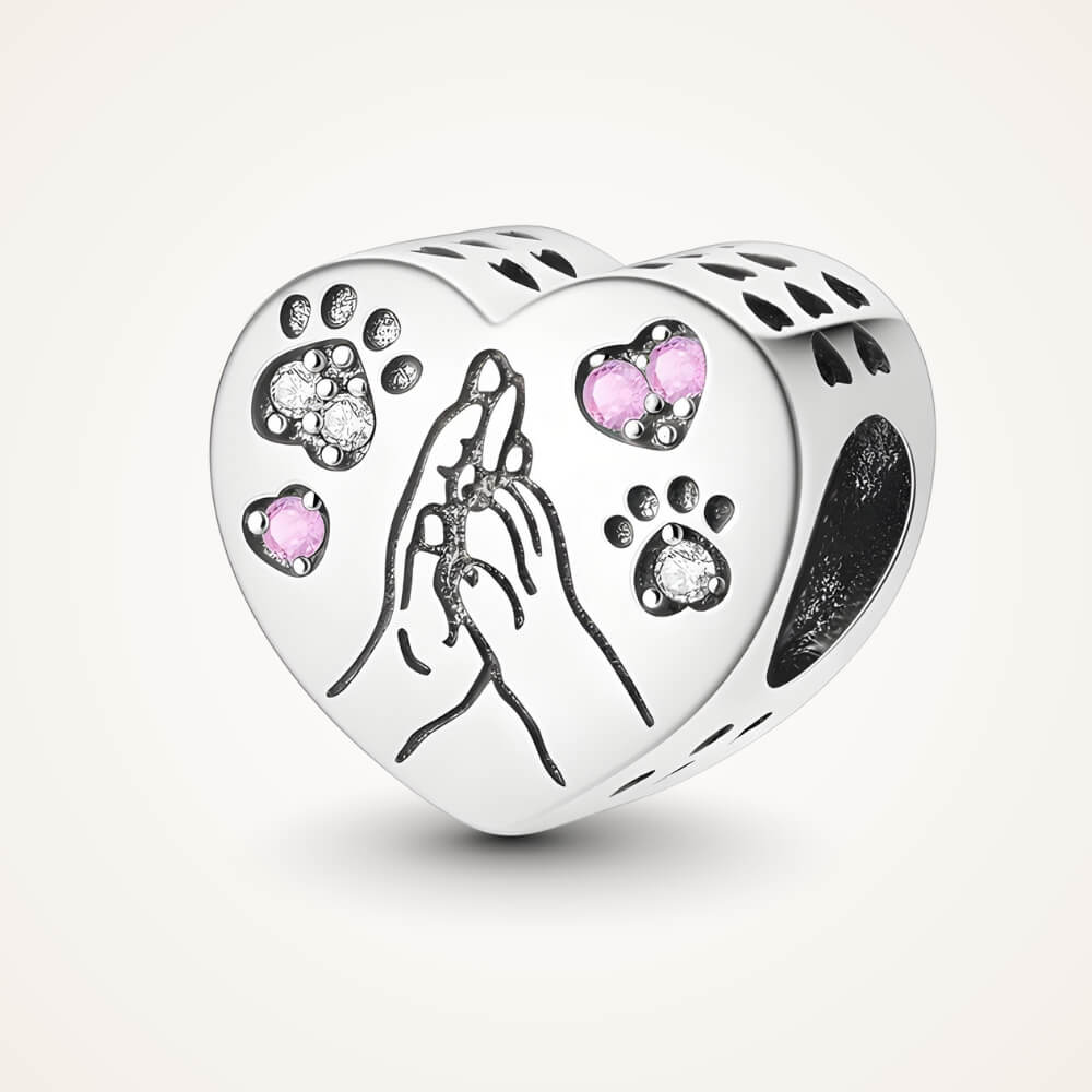 Sterling silver heart charm with engraved hand and paw design and pink crystal accents – ORÉYA