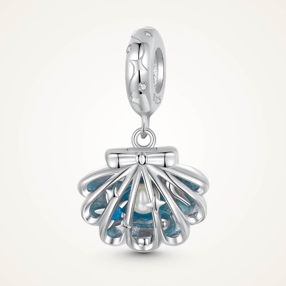 Sterling silver shell charm with hidden pearl and ocean blue enamel.