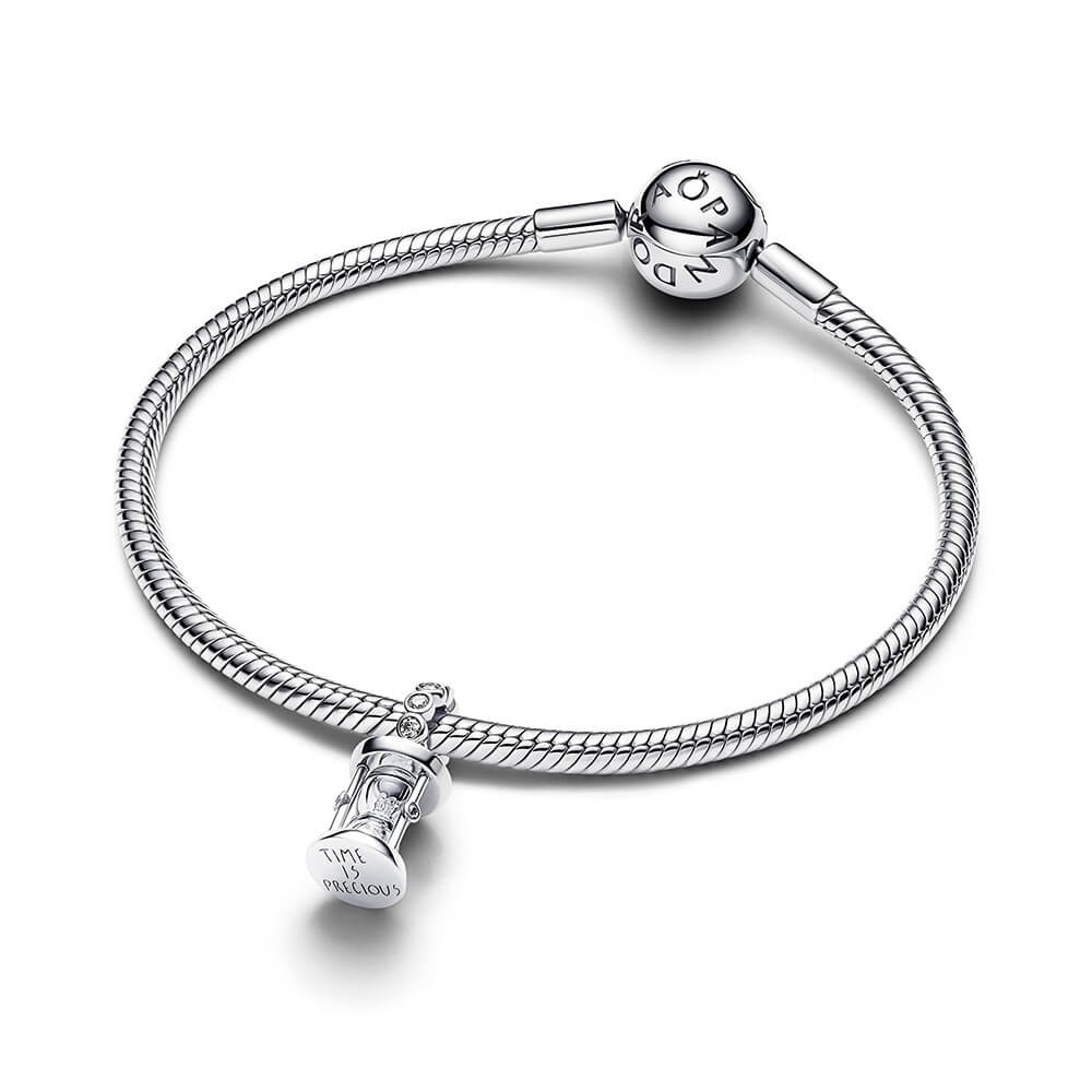 Sterling silver hourglass charm with clear crystals and glass center.