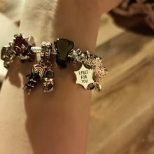 Sterling silver snowflake charm with pavé crystals and dangling icy design.
