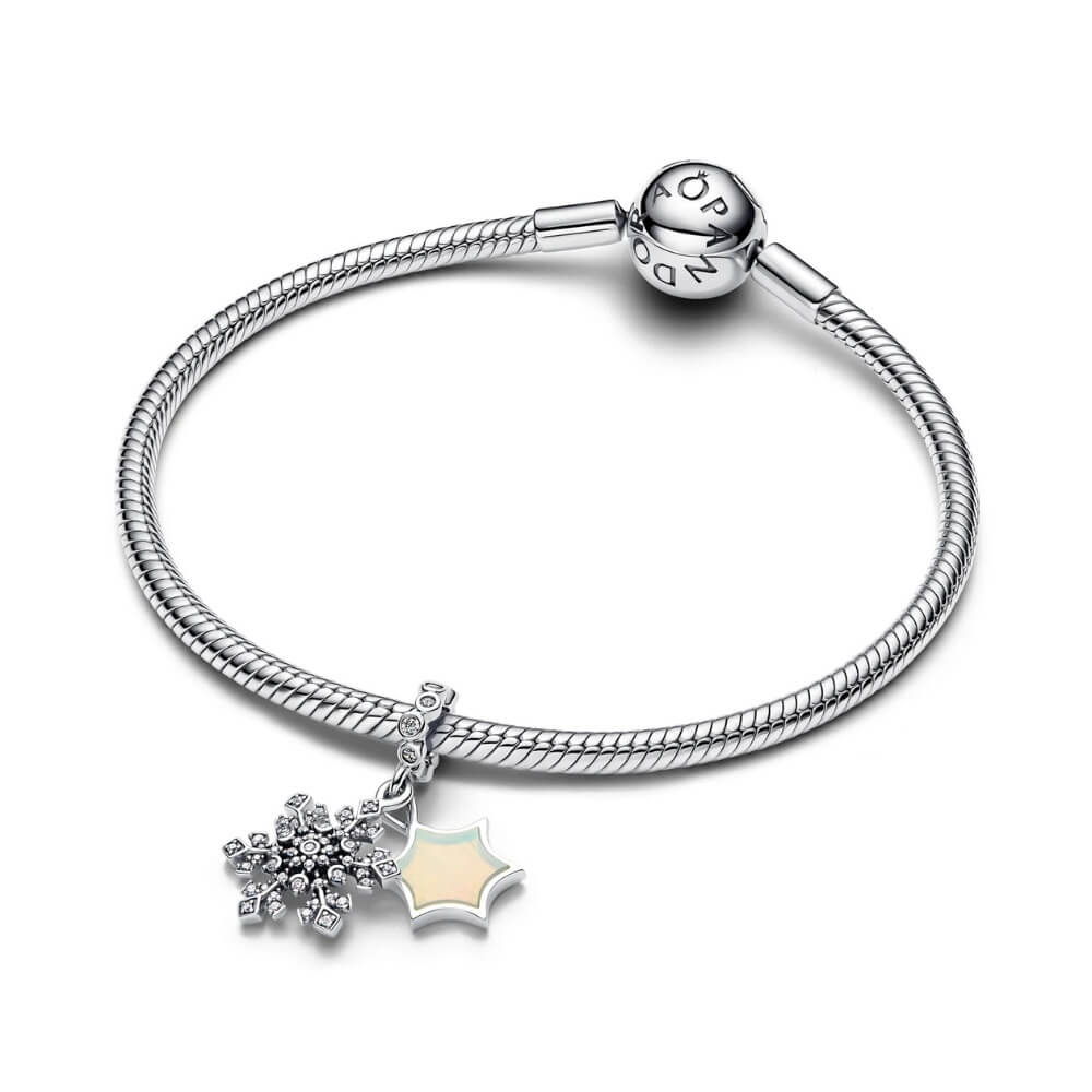 Sterling silver snowflake charm with pavé crystals and dangling icy design.
