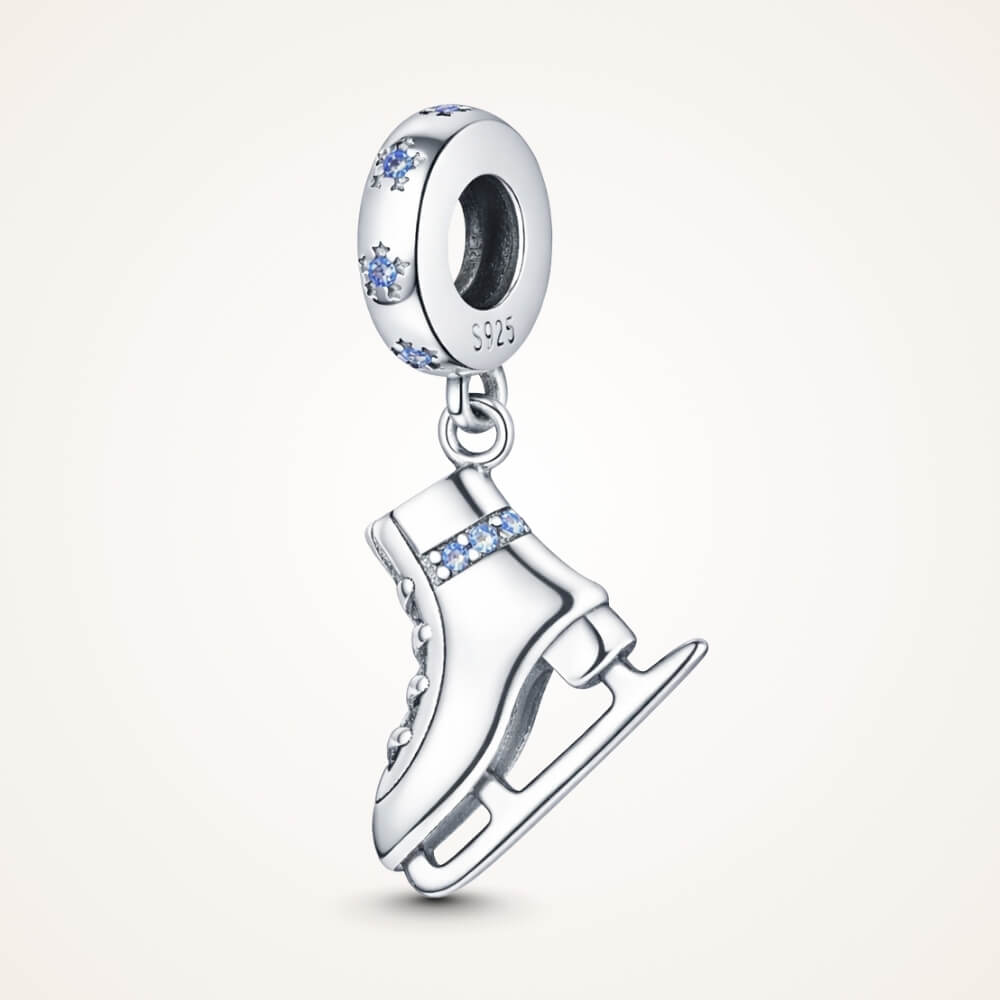 Sterling silver ice skate charm with blue crystal details and winter sparkle - ORÉYA