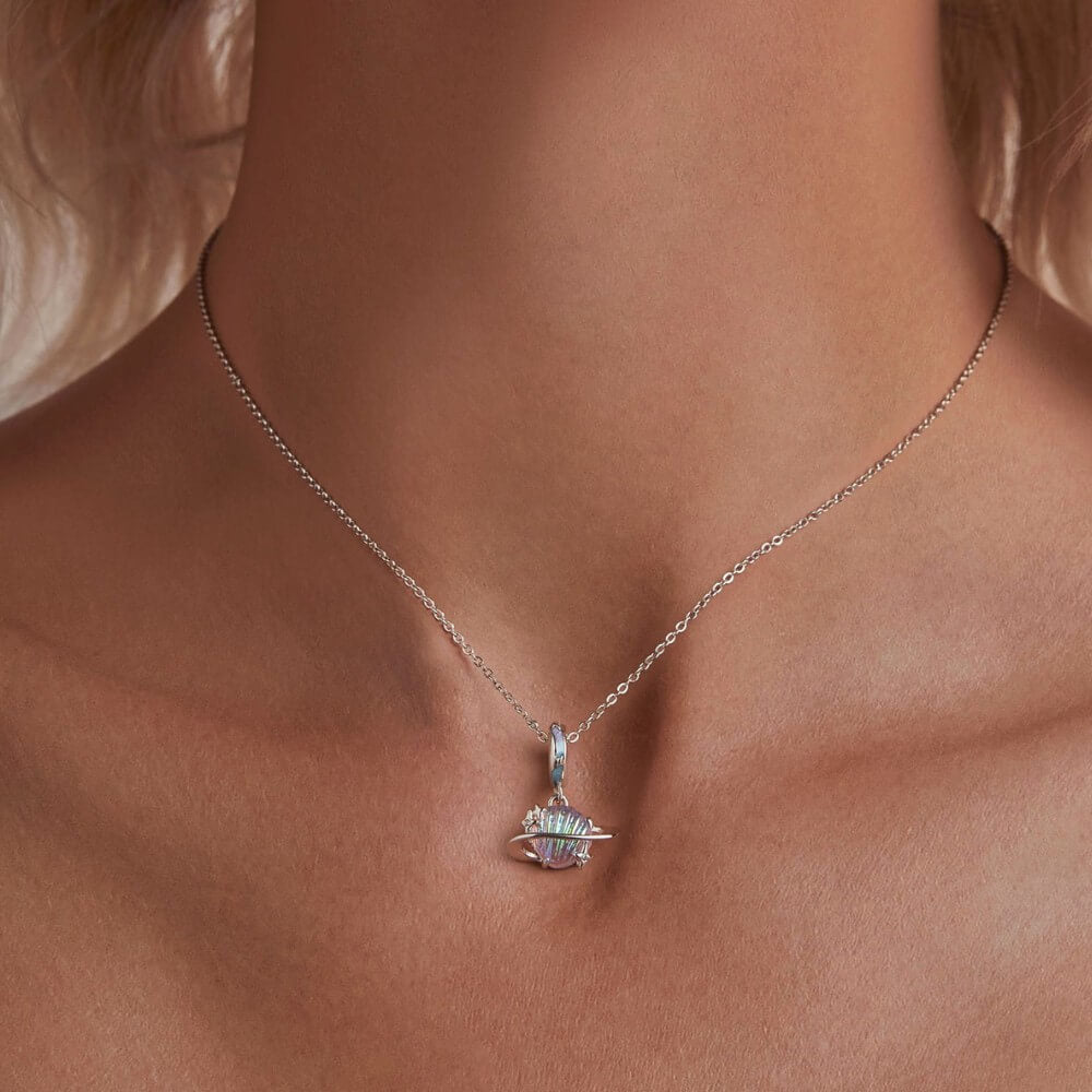 Sterling silver planet charm with iridescent shell design and star accents.