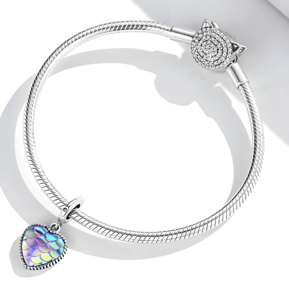 Sterling silver heart charm with iridescent scale-patterned resin front and beaded border.