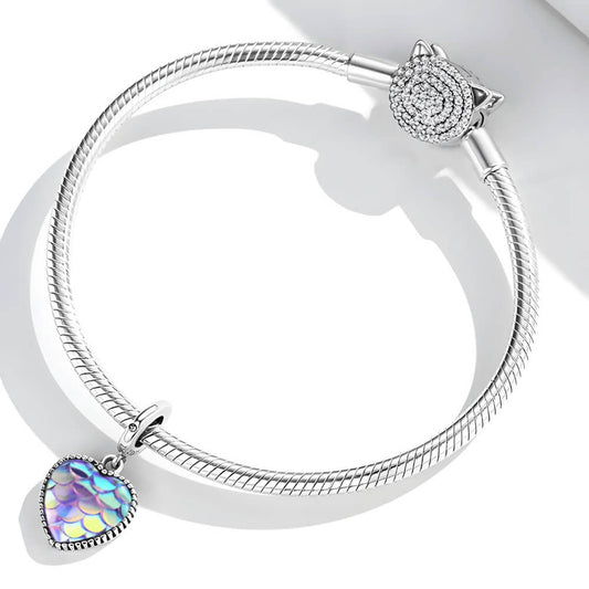 Sterling silver heart charm with iridescent scale-patterned resin front and beaded border.