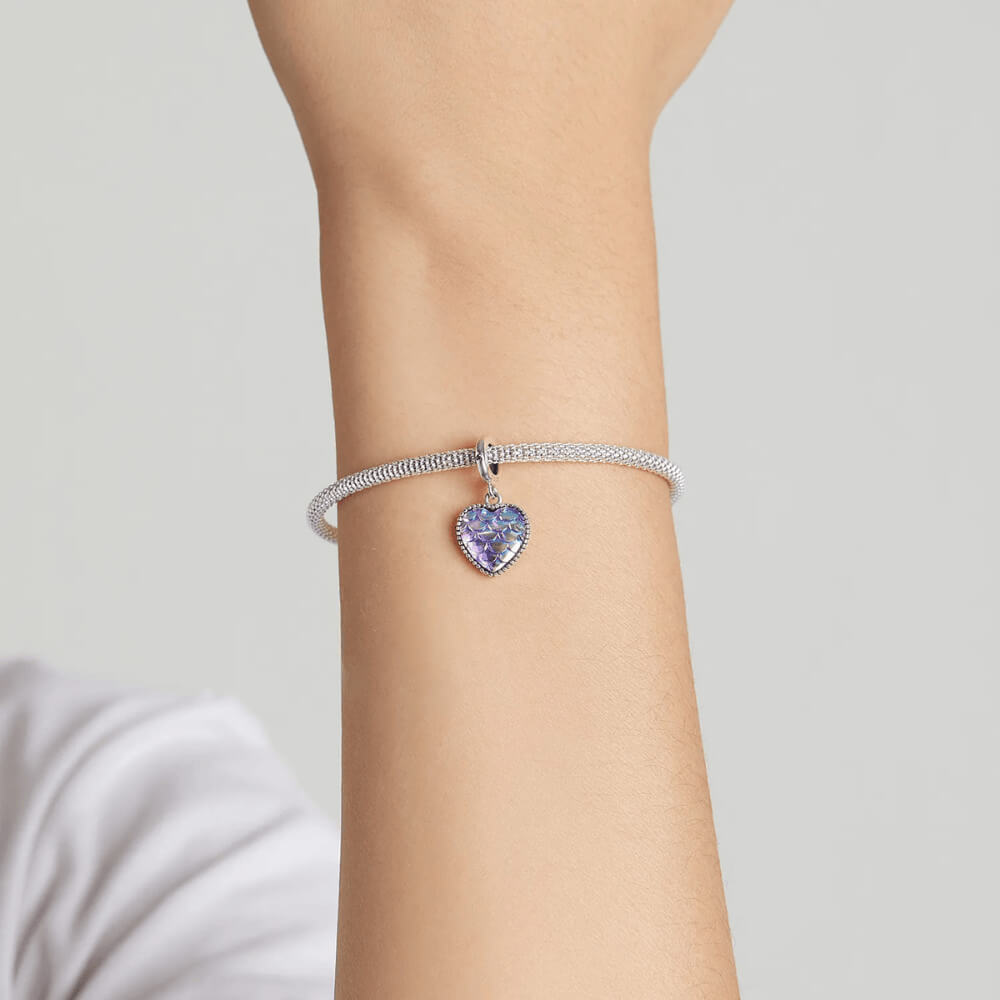 Sterling silver heart charm with iridescent scale-patterned resin front and beaded border.