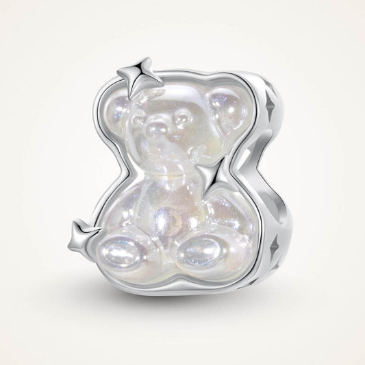 Sterling silver teddy bear charm with iridescent finish and star details.