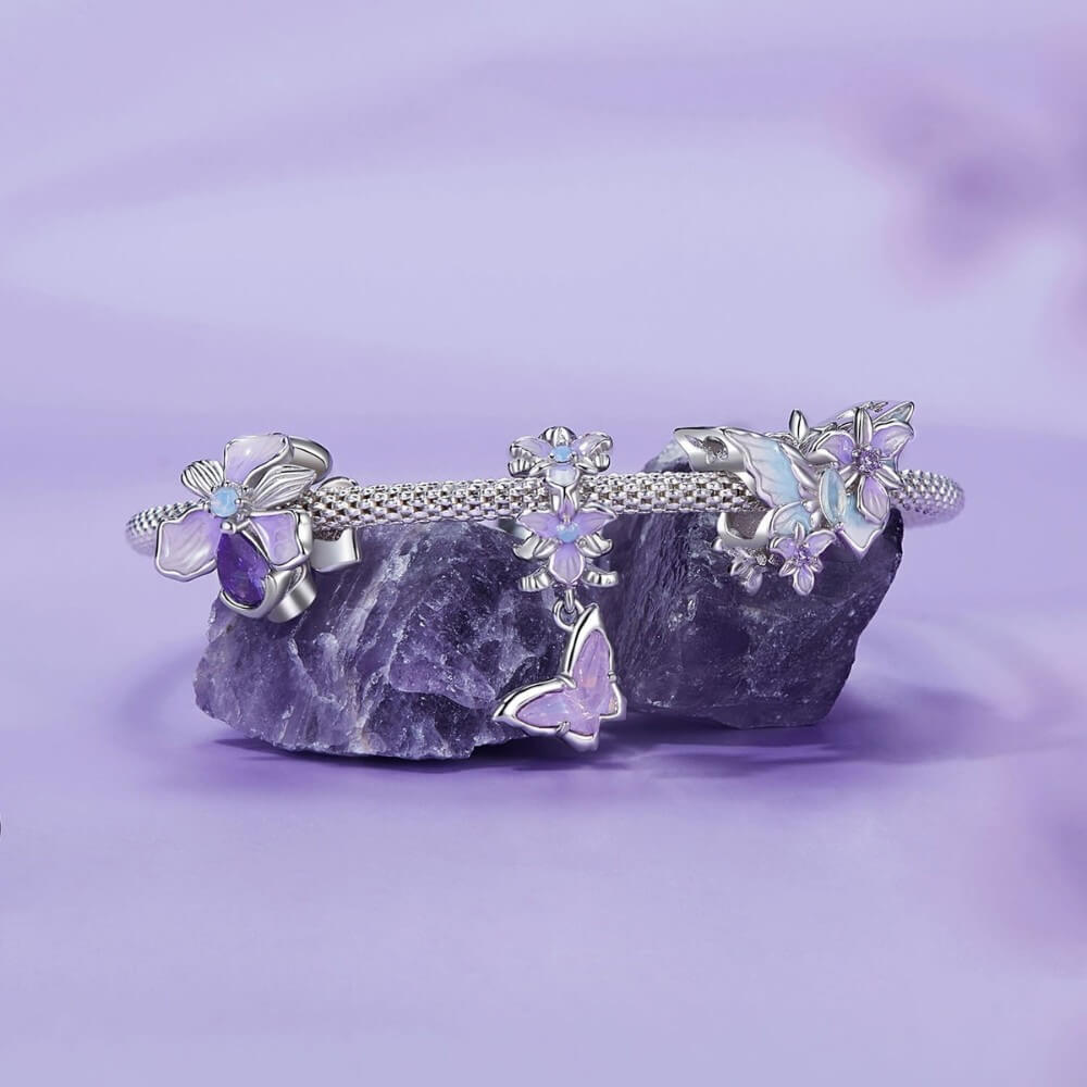 Sterling silver crystal charm with lavender flower and iridescent stone.