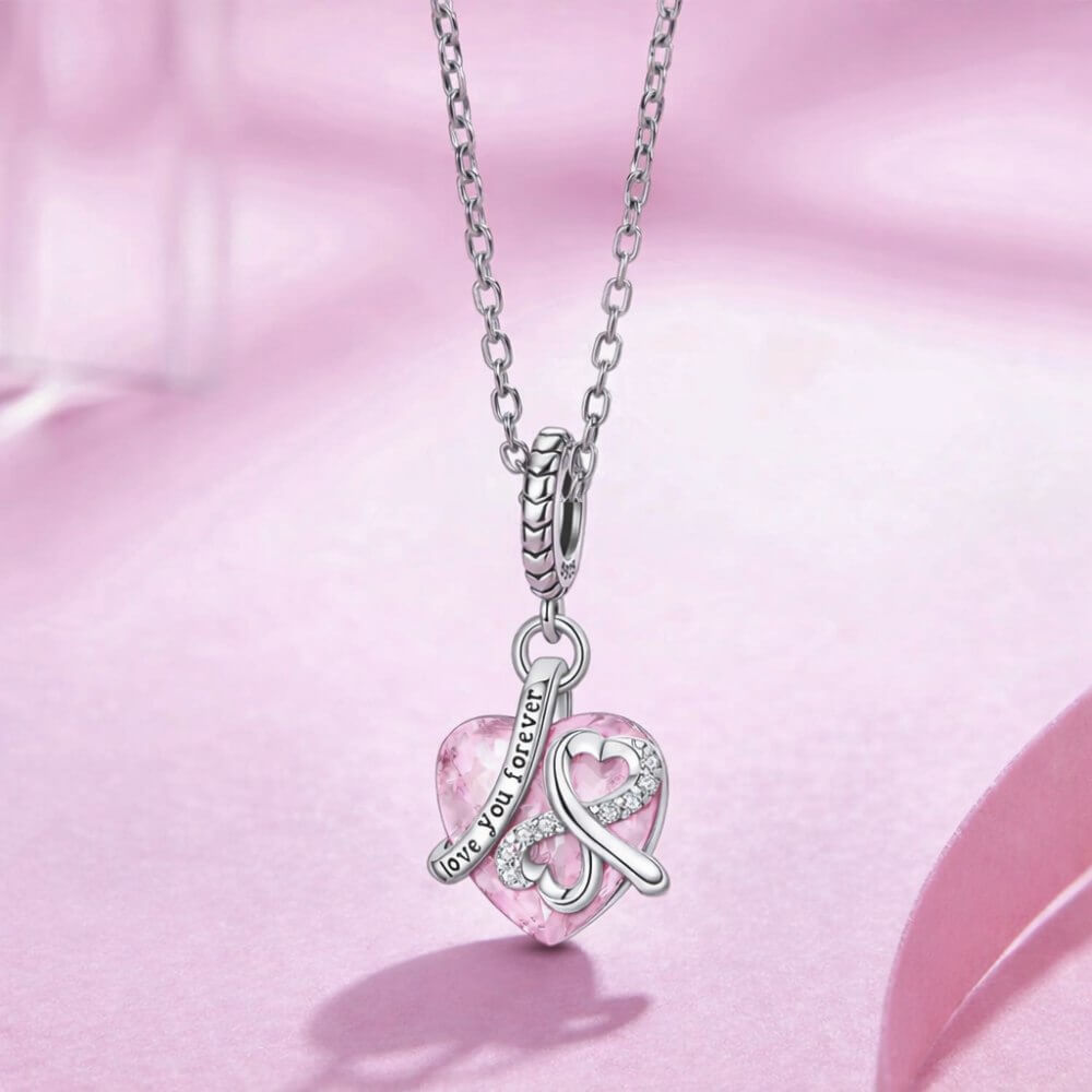 Sterling silver pink heart charm with infinity symbol and love you forever engraving.