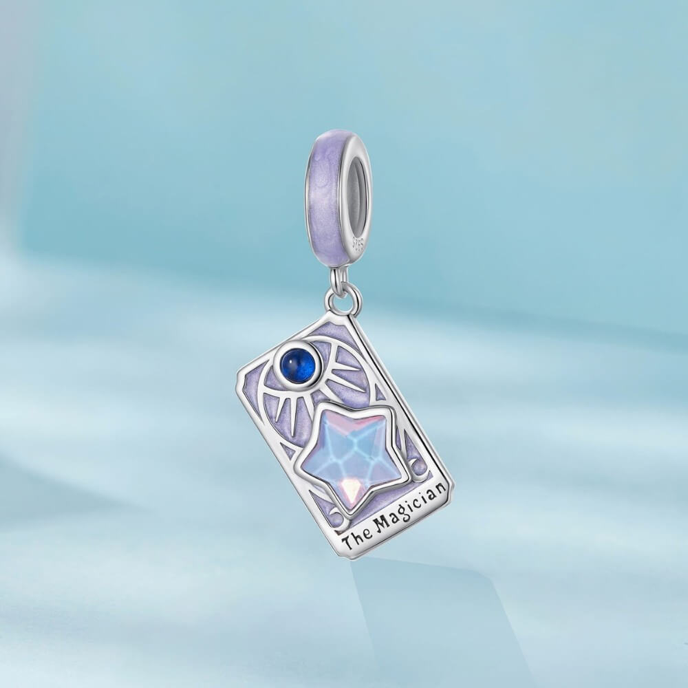 Sterling silver magician tarot charm with lavender enamel and iridescent star.