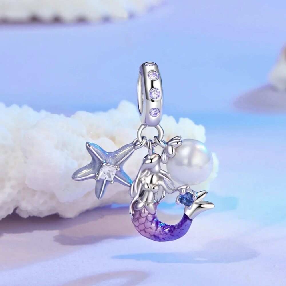 Sterling silver mermaid charm with pearl, starfish, and crystal accents.