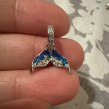 Sterling silver mermaid tail charm with blue purple enamel and crystal details.