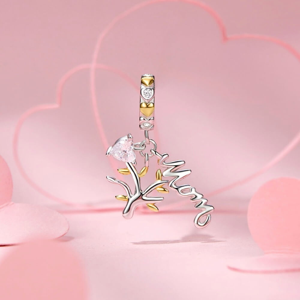Sterling silver family tree charm with mom script and heart crystal.