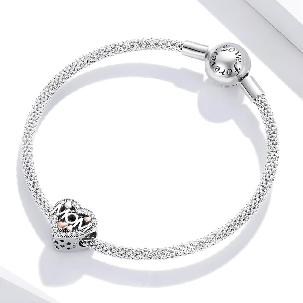 Sterling silver heart-shaped MOM charm with pavé crystals and mixed-metal rose gold and silver hearts 