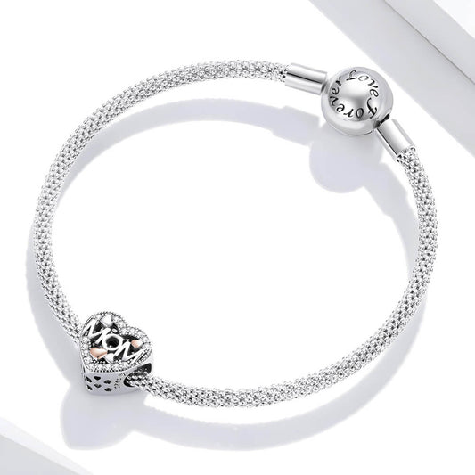 Sterling silver heart-shaped MOM charm with pavé crystals and mixed-metal rose gold and silver hearts 
