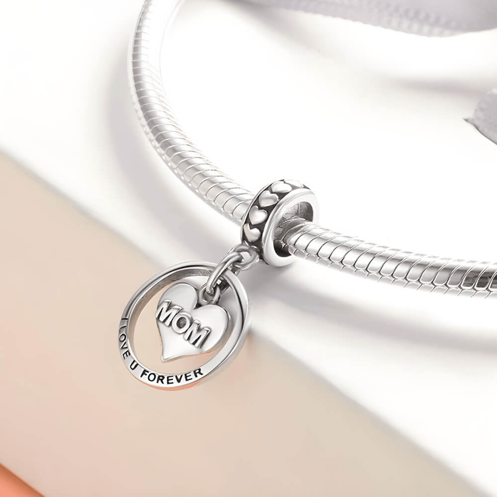 Sterling silver MOM heart charm with circular pendant engraved ‘I Love U Forever’ and heart details 