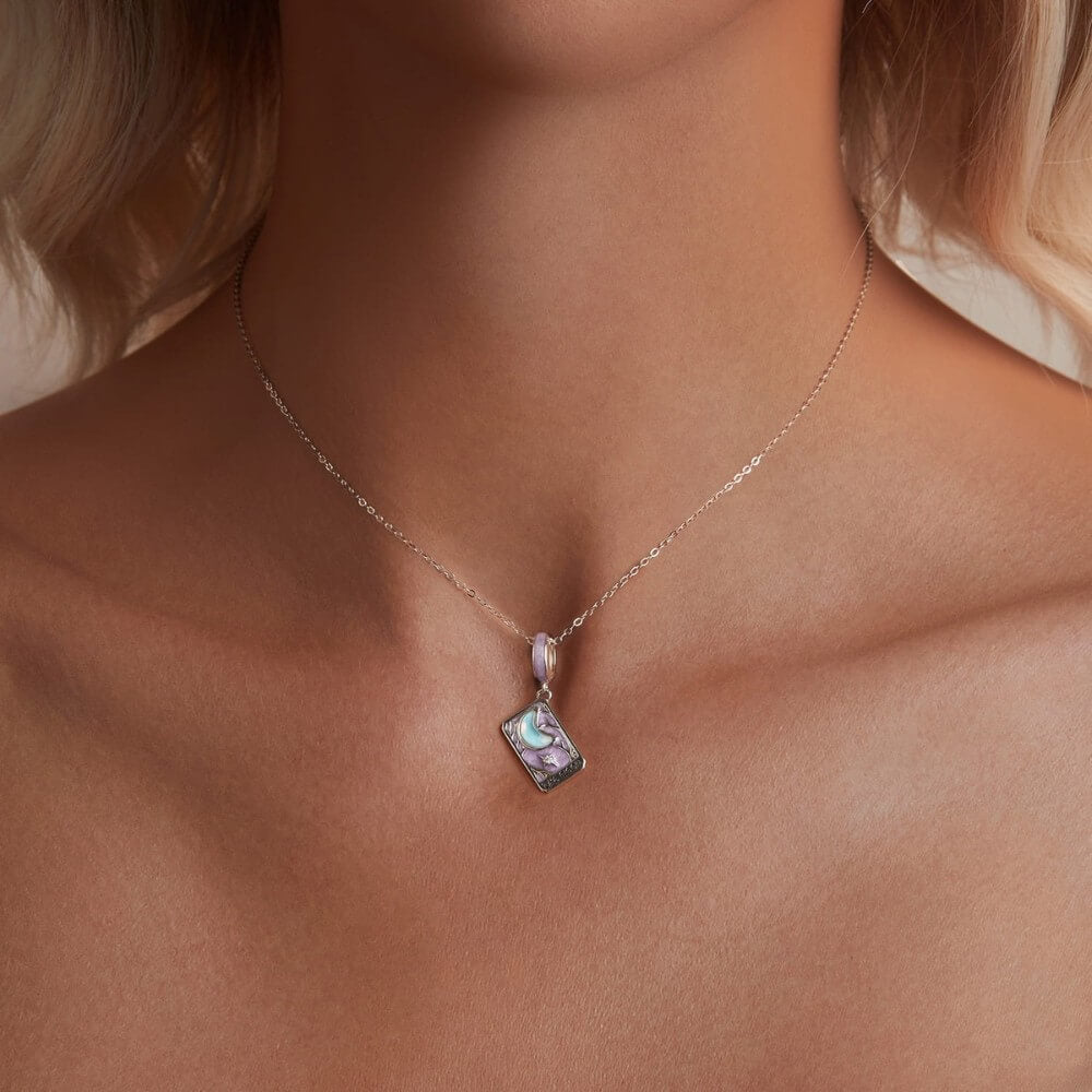 Sterling silver moon tarot charm with lavender enamel and iridescent moon.
