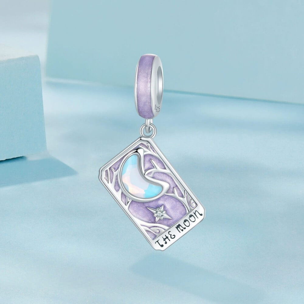 Sterling silver moon tarot charm with lavender enamel and iridescent moon.