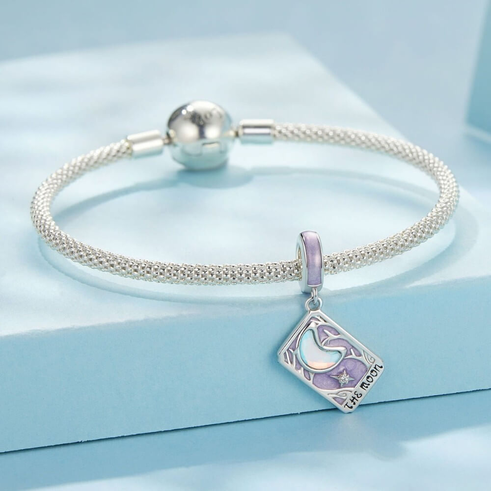 Sterling silver moon tarot charm with lavender enamel and iridescent moon.