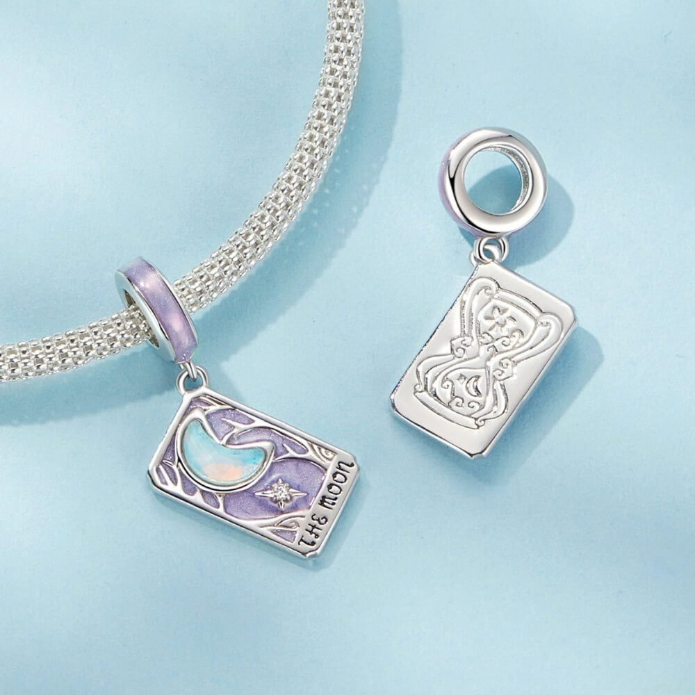 Sterling silver moon tarot charm with lavender enamel and iridescent moon.