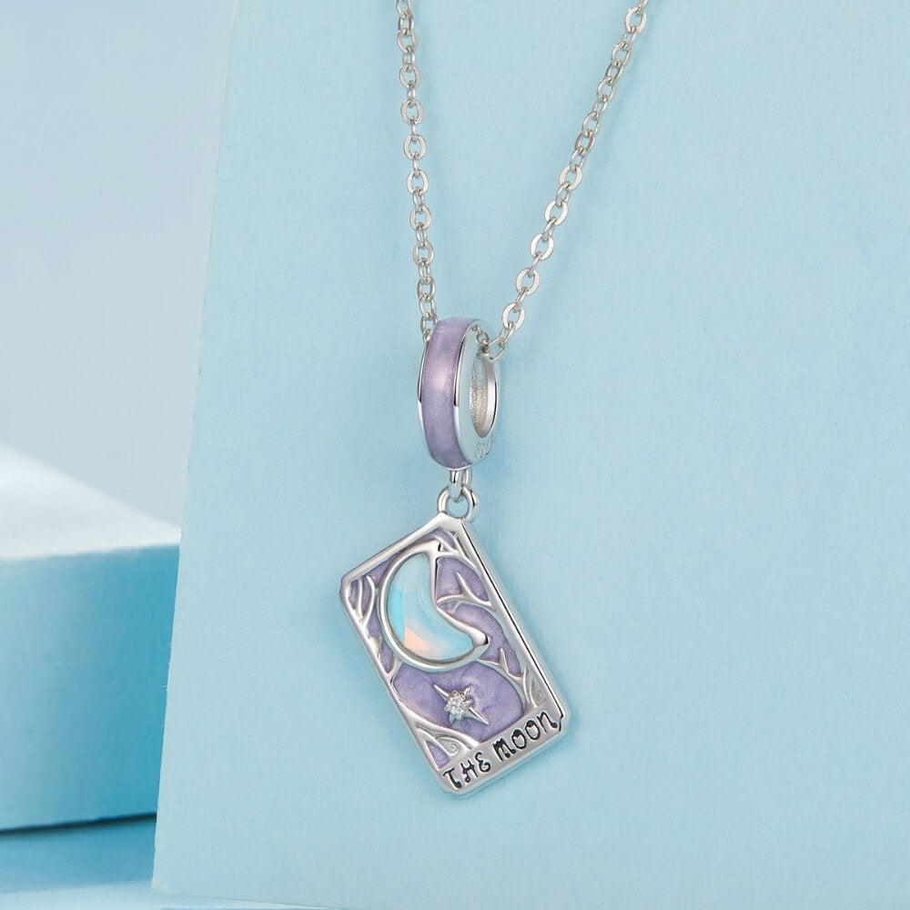 Sterling silver moon tarot charm with lavender enamel and iridescent moon.