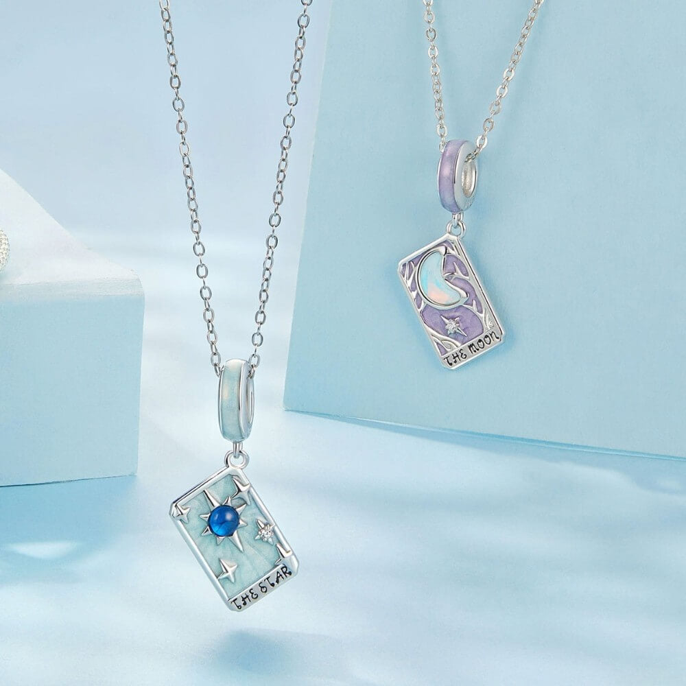 Sterling silver moon tarot charm with lavender enamel and iridescent moon.