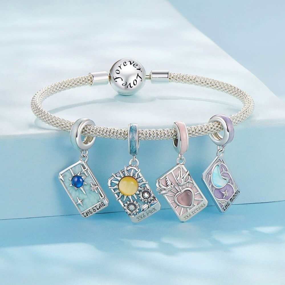 Sterling silver moon tarot charm with lavender enamel and iridescent moon.