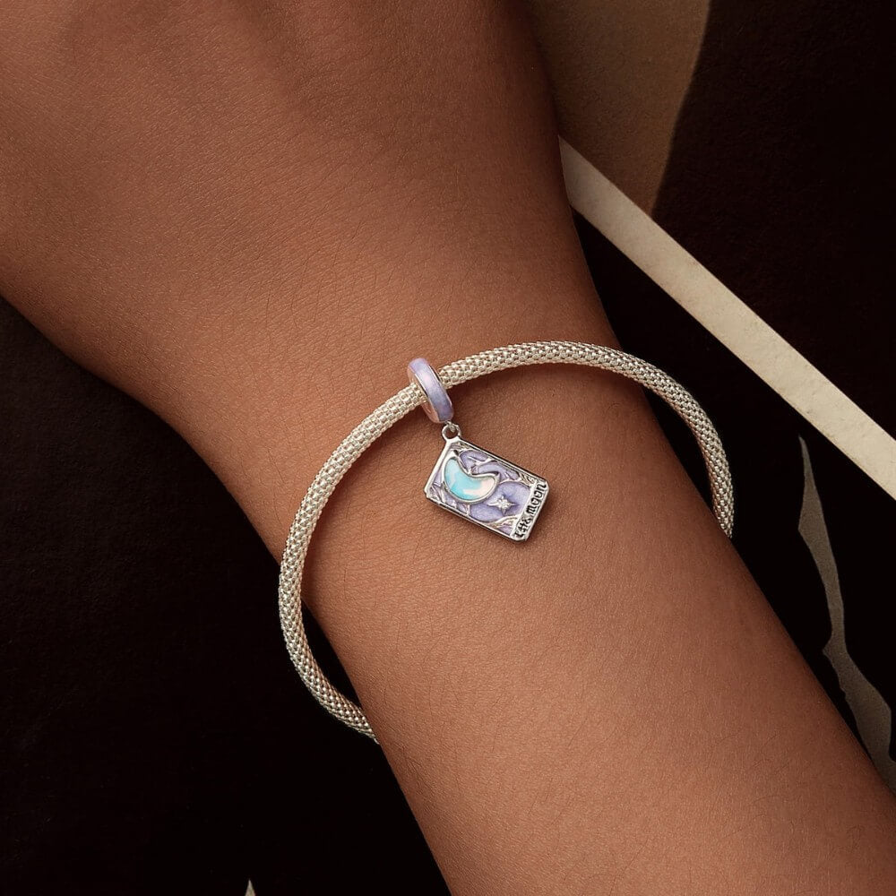 Sterling silver moon tarot charm with lavender enamel and iridescent moon.