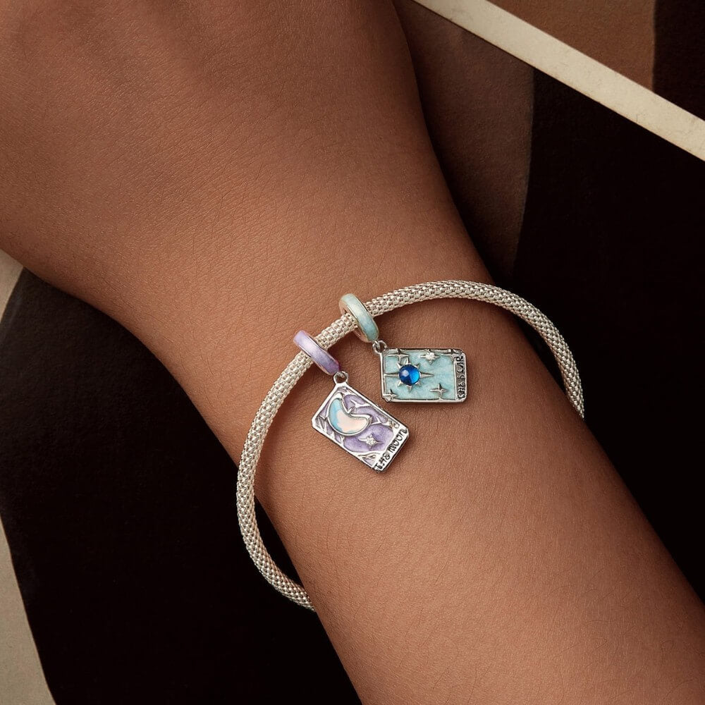 Sterling silver moon tarot charm with lavender enamel and iridescent moon.
