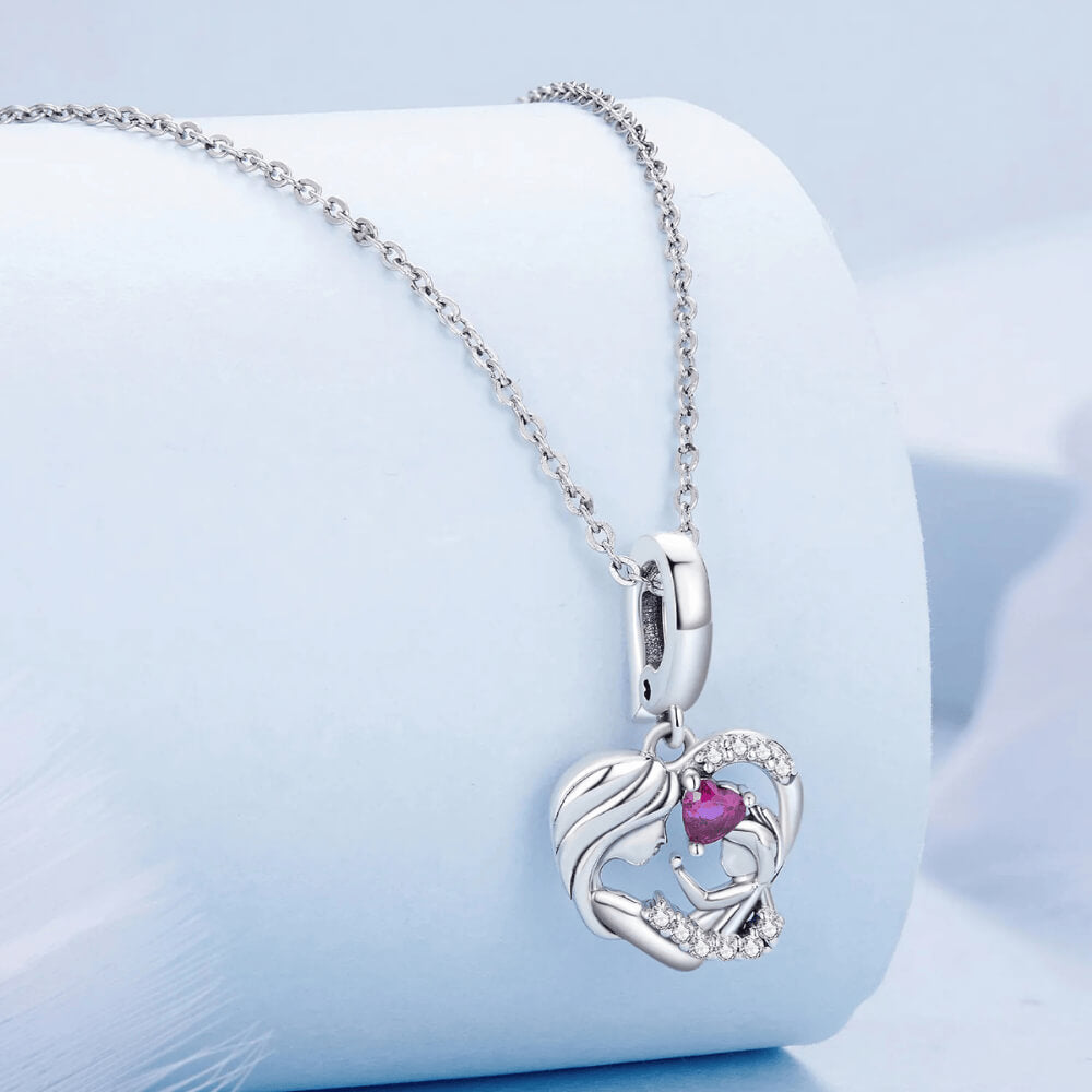 Sterling silver mother and child heart charm with pink heart gemstone and crystal accents 