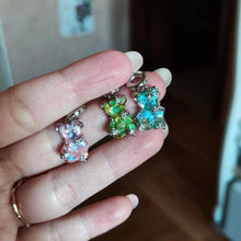 Sterling silver teddy bear charm with pink opalescent glass and crystal accents.