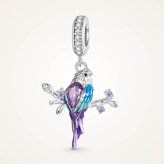 Sterling silver parrot charm with purple crystal, blue enamel, and branch details - ORÉYA