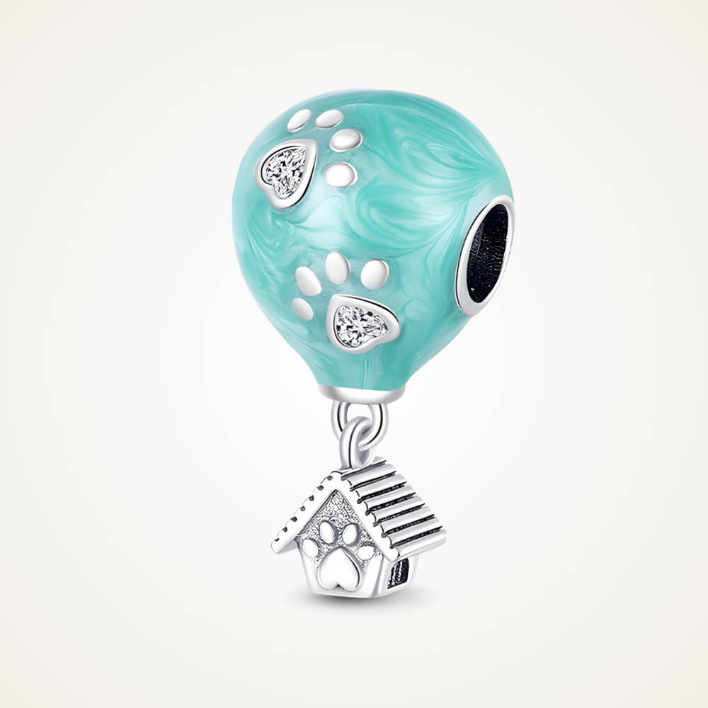 Turquoise balloon-shaped charm with silver paw prints and dangling dog house – ORÉYA