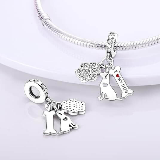 Sterling silver charm with crystal paw print, dog silhouette, and ‘I love my dog’ bone tag