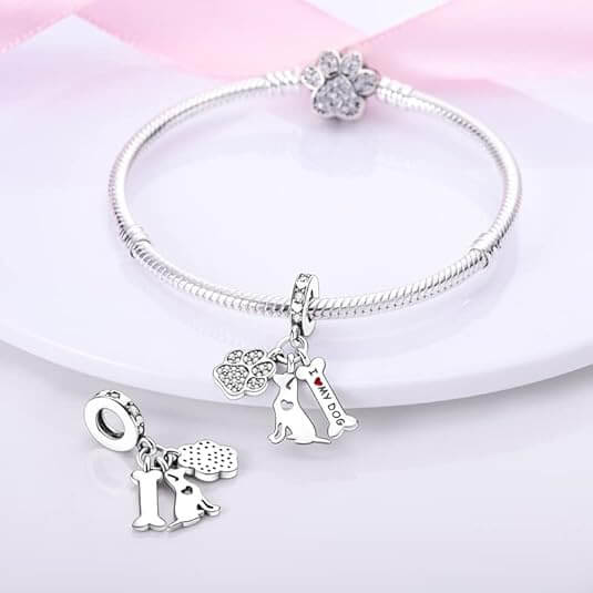 Sterling silver charm with crystal paw print, dog silhouette, and ‘I love my dog’ bone tag