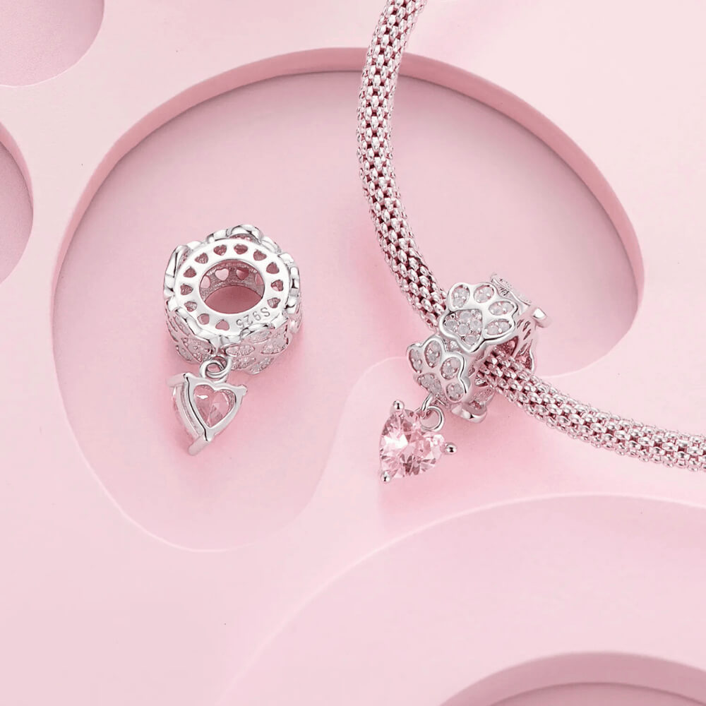 Sterling silver paw-print charm with opal stones and pink heart dangle