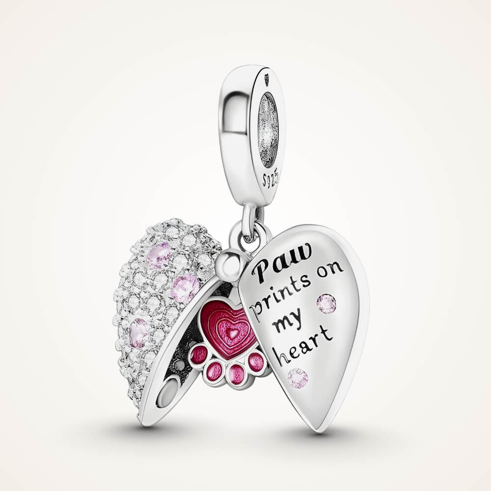Sterling silver locket-style charm with pink paw heart detail and ‘Paw prints on my heart’ engraving – ORÉYA