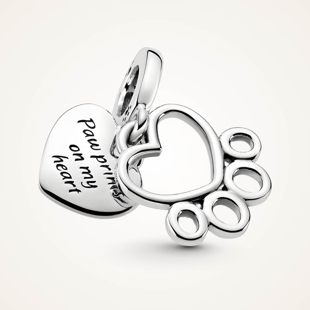 Sterling silver charm with heart outline paw print and engraved ‘Pawprints on my heart’ tag – ORÉYA