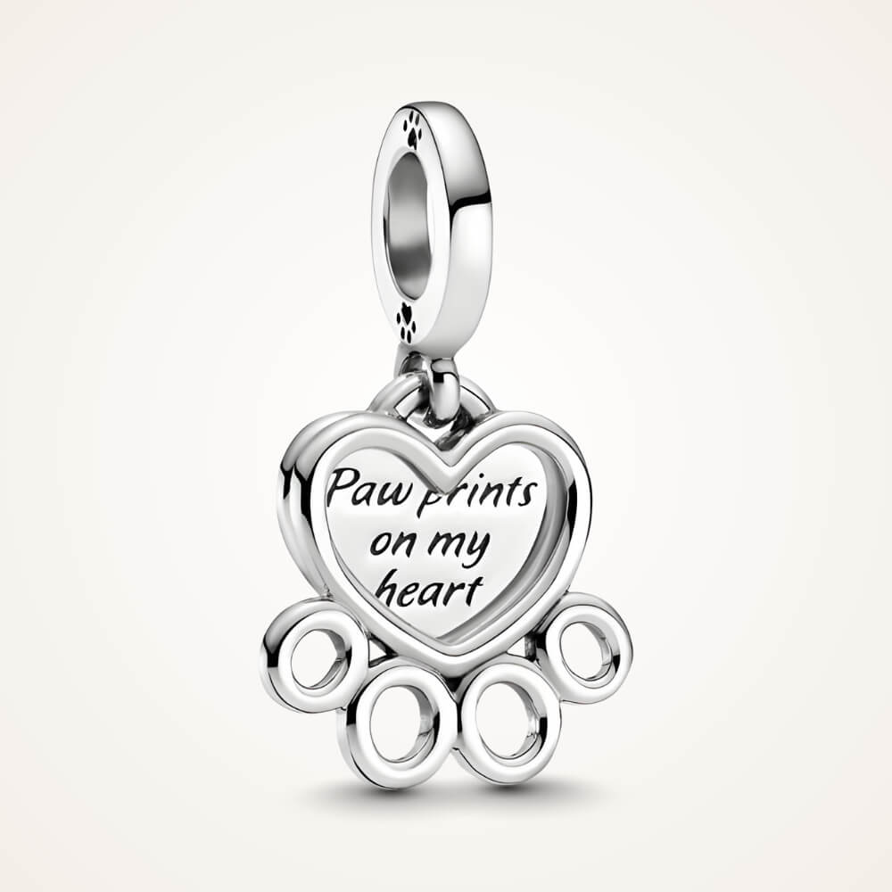 Sterling silver charm with heart outline paw print and engraved ‘Pawprints on my heart’ tag