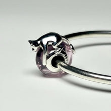 Sterling silver cat charm with pink crystal body and heart detail.