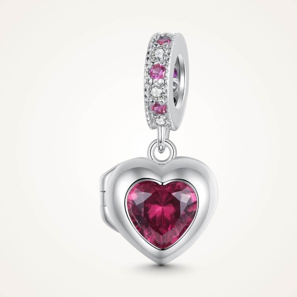 Sterling silver heart locket charm with deep pink crystal center and sparkling pink and clear stone details - ORÉYA