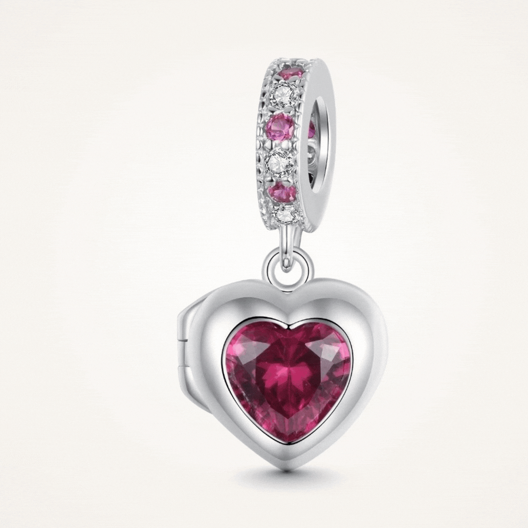 Sterling silver heart locket charm with deep pink crystal center and sparkling pink and clear stone details - ORÉYA