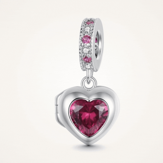 Sterling silver heart locket charm with deep pink crystal center and sparkling pink and clear stone details - ORÉYA