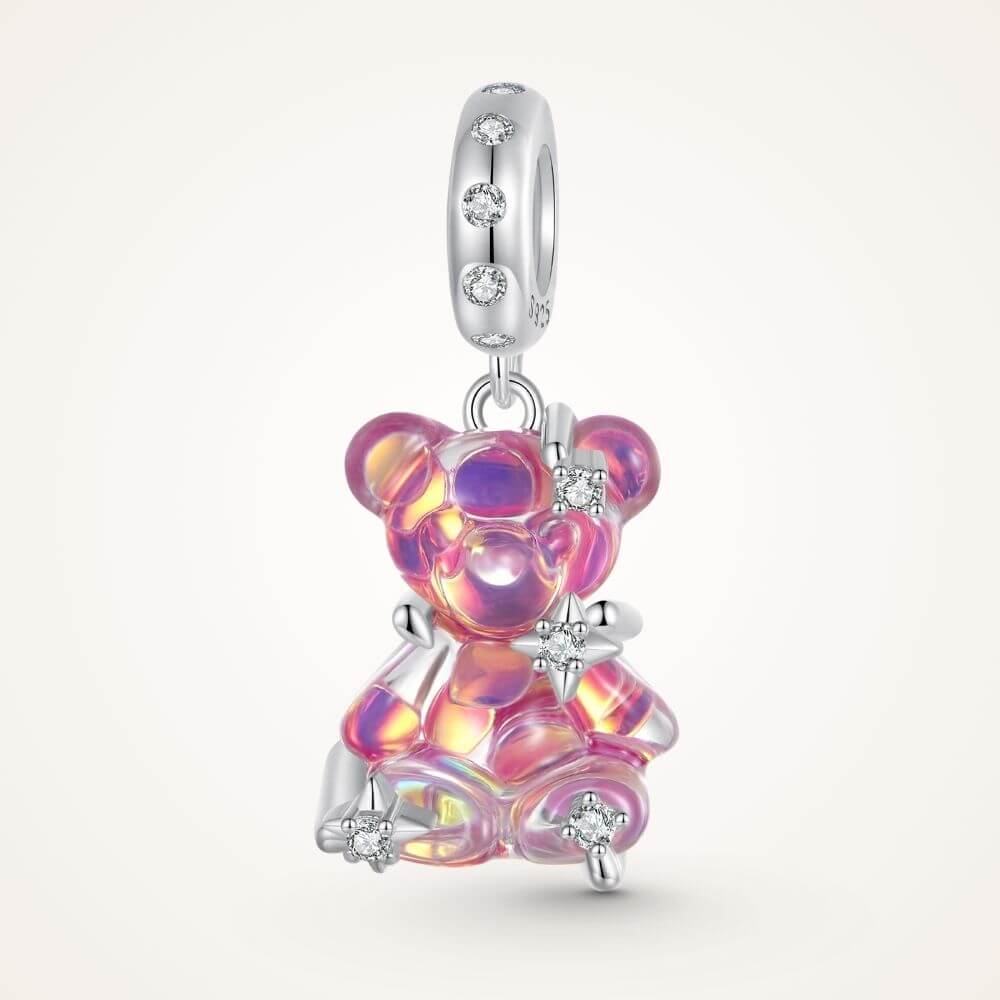 Sterling silver pink teddy bear charm with iridescent finish, sparkling stars, and clear crystal accents - ORÉYA