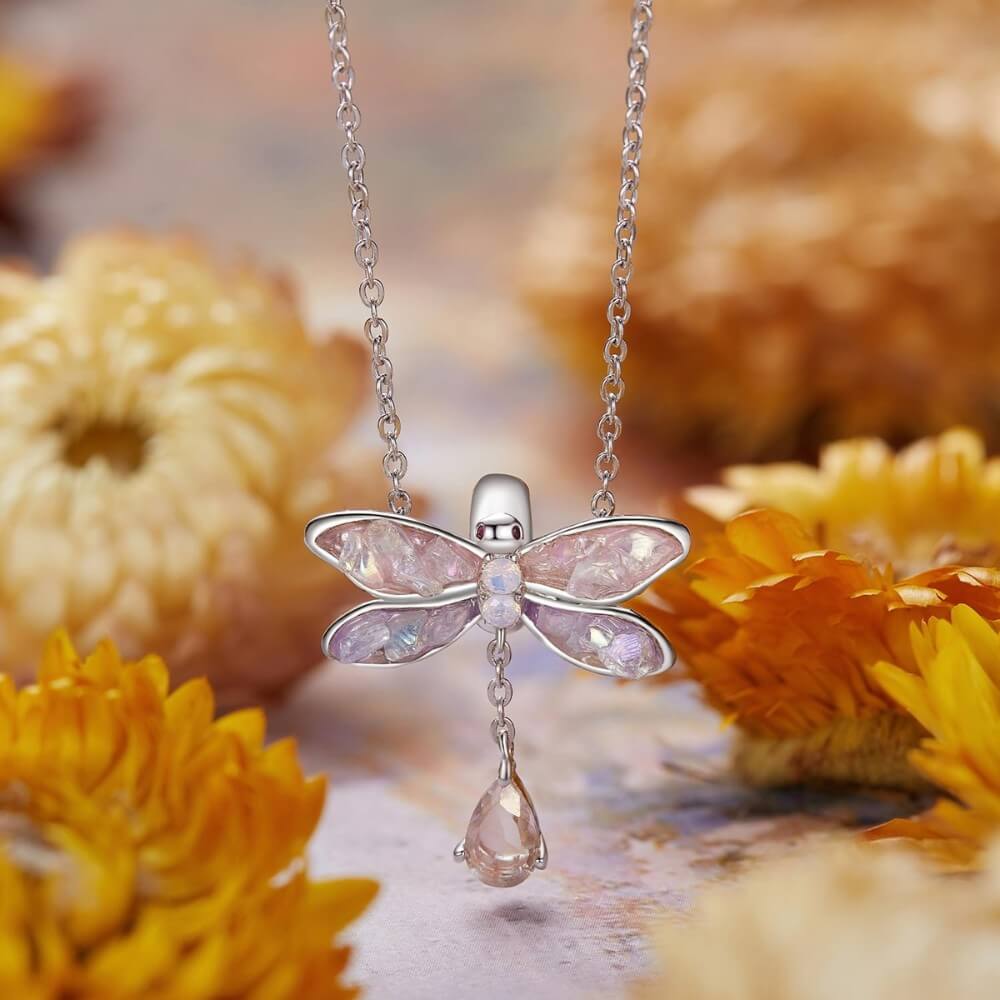Sterling silver dragonfly charm with pink lavender wings and crystal drop.