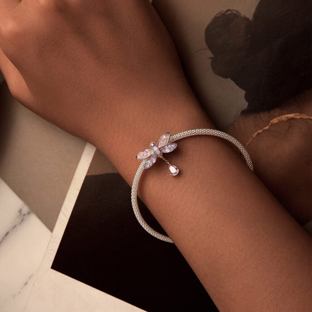 Sterling silver dragonfly charm with pink lavender wings and crystal drop.