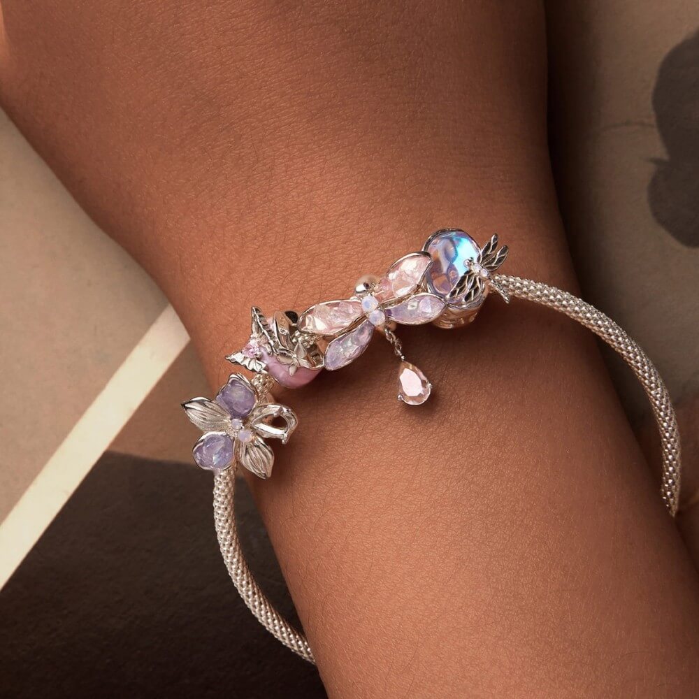 Sterling silver dragonfly charm with pink lavender wings and crystal drop.