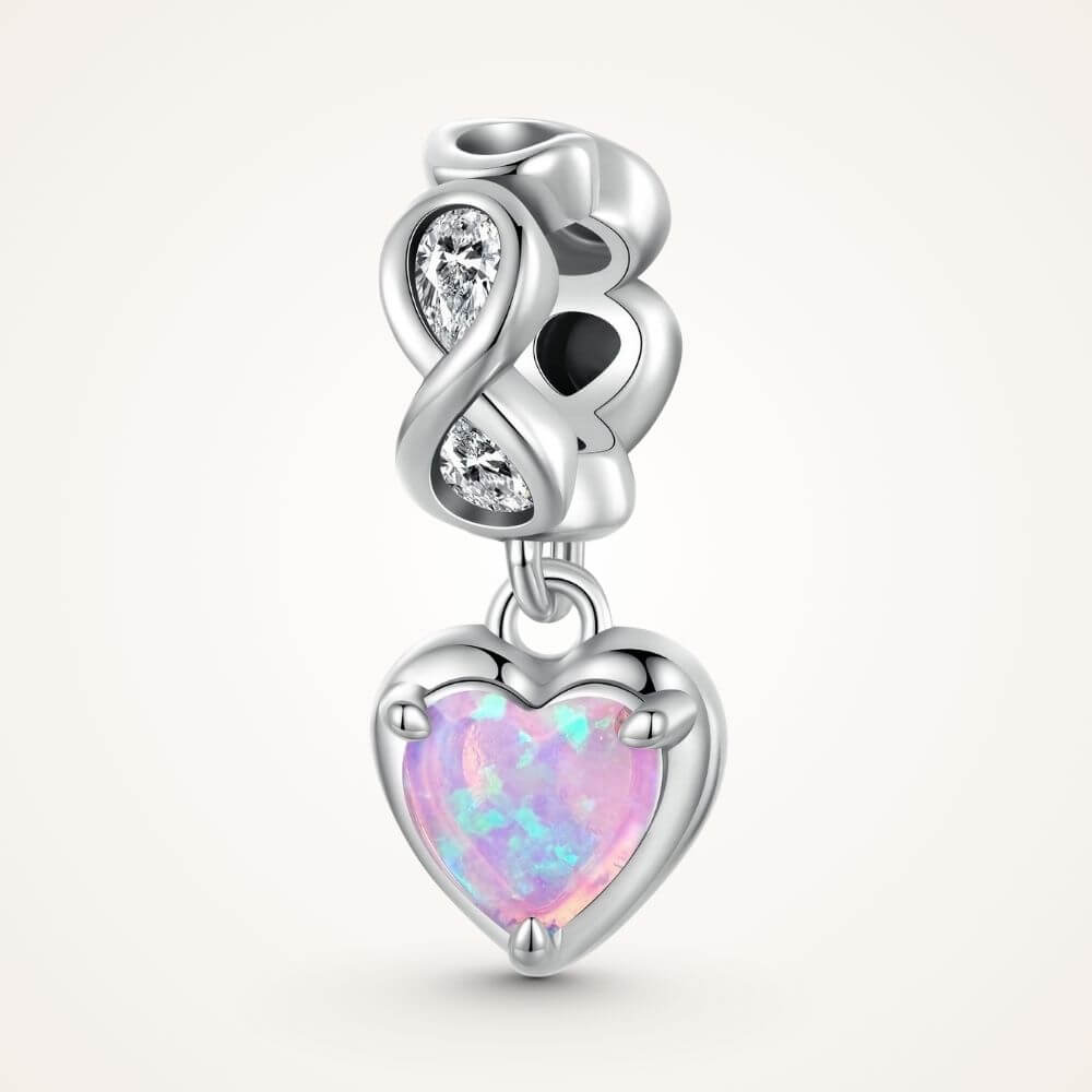 Sterling silver heart charm with pink opal center, infinity loop, and sparkling clear crystal details - ORÉYA