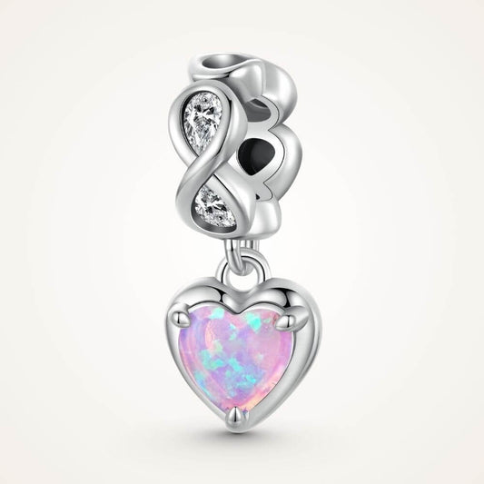 Sterling silver heart charm with pink opal center, infinity loop, and sparkling clear crystal details - ORÉYA